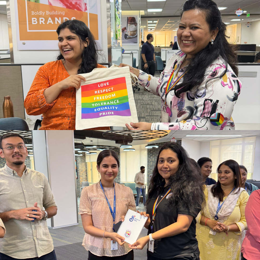 A collage of two photos taken inside an office during a Pride-themed activity. In the top photo, two people stand together holding a canvas tote bag printed with rainbow-colored stripes and words including “Love,” “Respect,” “Freedom,” “Tolerance,” “Equality,” and “Pride.” In the bottom photo, a group of people stand in a workspace while one person hands a Pride-branded booklet or prize to another. Office desks, posters, and décor are visible in the background.